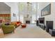 Spacious living room with fireplace, tall windows, and comfortable seating at 2924 Meadow Church Rd, Suwanee, GA 30024