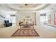 Spacious main bedroom featuring a tray ceiling, sitting area, and access to a private balcony at 2924 Meadow Church Rd, Suwanee, GA 30024
