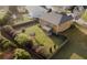 Aerial view of backyard featuring a well-manicured lawn, privacy fence, and mature landscaping at 3354 Preserve Run Trl, Loganville, GA 30052