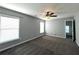 Bedroom featuring soft carpet, ceiling fan, and bright natural light at 3354 Preserve Run Trl, Loganville, GA 30052