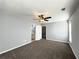 Bedroom boasts neutral walls, carpet, and a ceiling fan, leading to an ensuite bathroom at 3354 Preserve Run Trl, Loganville, GA 30052
