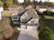 Aerial view of home showcasing a well-manicured lawn and two-car garage at 3354 Preserve Run Trl, Loganville, GA 30052