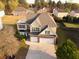 Aerial view of home showcasing a well-manicured lawn and two-car garage at 3354 Preserve Run Trl, Loganville, GA 30052