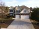 Charming traditional home with manicured landscaping, two-car garage, and inviting front entry at 3354 Preserve Run Trl, Loganville, GA 30052