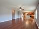 Open concept living room and kitchen with hardwood floors, tile and plenty of natural light at 3354 Preserve Run Trl, Loganville, GA 30052