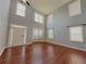 Bright, airy living room featuring hardwood floors, large windows, and natural light at 3354 Preserve Run Trl, Loganville, GA 30052