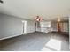 Spacious loft area with soft carpet, ceiling fan, and plenty of natural light at 3354 Preserve Run Trl, Loganville, GA 30052