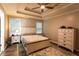 Cozy bedroom with neutral walls, lots of natural light, and a comfortable queen bed at 355 Freeman Dr, Covington, GA 30016
