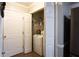 Laundry closet with white washer and dryer at 355 Freeman Dr, Covington, GA 30016