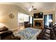 Inviting living room with a stone fireplace, ceiling fan, and beautiful leather seating at 355 Freeman Dr, Covington, GA 30016