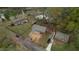 Aerial view showcasing the home's setting among mature trees in a established neighborhood at 7535 Asbury Dr, Riverdale, GA 30274