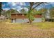 Spacious backyard featuring mature trees, offering a private and serene outdoor space at 7535 Asbury Dr, Riverdale, GA 30274