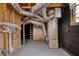 Basement featuring mechanical equipment, concrete floor, and black-painted brick walls at 7535 Asbury Dr, Riverdale, GA 30274