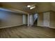 The empty basement has new wood flooring, perfect for someone looking to design their dream space at 7535 Asbury Dr, Riverdale, GA 30274
