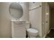 A half bath featuring a vanity and mirror at 7535 Asbury Dr, Riverdale, GA 30274