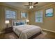 Bedroom features a stylish bed, modern flooring, neutral paint, and well-chosen decor at 7535 Asbury Dr, Riverdale, GA 30274