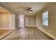 Spacious bedroom with wood-look floors and lots of natural light at 7535 Asbury Dr, Riverdale, GA 30274