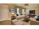 Cozy living room featuring modern furniture, soft rug, and a stylish coffee table at 7535 Asbury Dr, Riverdale, GA 30274