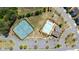 Aerial view of community amenities including pool, tennis courts, playground, and ample parking at 930 Crestview Dr, Johns Creek, GA 30024