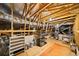 Spacious attic with exposed wooden beams and unfinished plywood subflooring at 930 Crestview Dr, Johns Creek, GA 30024