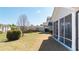 Side view of the backyard, showcasing its size, screened-in porch, and landscaping at 930 Crestview Dr, Johns Creek, GA 30024