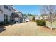 View of the backyard featuring a well-maintained lawn and a screened-in porch at 930 Crestview Dr, Johns Creek, GA 30024