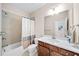 Stylish bathroom featuring a tub-shower, white countertop, and sleek fixtures at 930 Crestview Dr, Johns Creek, GA 30024
