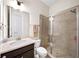 Bathroom with a glass shower and a stylish vanity at 930 Crestview Dr, Johns Creek, GA 30024