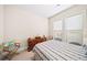 Well-lit bedroom with two windows, comfy carpet, and a decorative chair at 930 Crestview Dr, Johns Creek, GA 30024