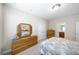 Bedroom with bed, dresser, and closet, and doorway leading to another room at 930 Crestview Dr, Johns Creek, GA 30024