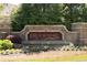 Elegant brick sign for Brookmere at Johns Creek, surrounded by lush landscaping and mature trees at 930 Crestview Dr, Johns Creek, GA 30024