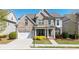 Charming two-story brick home with a well-manicured lawn and attached two-car garage at 930 Crestview Dr, Johns Creek, GA 30024