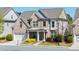 Stunning two-story brick home with a manicured lawn and covered entryway in a desirable location at 930 Crestview Dr, Johns Creek, GA 30024