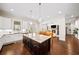 Spacious open kitchen featuring granite island, stainless appliances, and hardwood floors at 930 Crestview Dr, Johns Creek, GA 30024