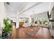 Bright living room featuring hardwood floors, a ceiling fan, and ample natural light at 930 Crestview Dr, Johns Creek, GA 30024