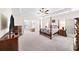 Spacious main bedroom features tray ceilings, four-poster bed, and a cozy sitting area at 930 Crestview Dr, Johns Creek, GA 30024