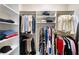Functional walk-in closet offers generous storage with various shelving and hanging options at 930 Crestview Dr, Johns Creek, GA 30024