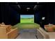 Indoor golf simulator room offering a realistic golfing experience with comfortable seating at 2425 Peachtree Ne Rd # 1211, Atlanta, GA 30305