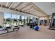State-of-the-art gym featuring treadmills, weight machines, and large windows with scenic views at 2425 Peachtree Ne Rd # 1211, Atlanta, GA 30305