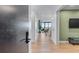 Hallway leading to an open living space with hardwood floors at 2425 Peachtree Ne Rd # 1211, Atlanta, GA 30305