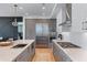 Modern kitchen with stainless appliances, gray cabinets and quartz counters at 2425 Peachtree Ne Rd # 1211, Atlanta, GA 30305
