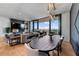 Open living room with hardwood floors, fireplace and scenic balcony views at 2425 Peachtree Ne Rd # 1211, Atlanta, GA 30305