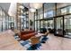 Modern lobby features high ceilings, comfortable seating, and bright light through expansive windows at 2425 Peachtree Ne Rd # 1211, Atlanta, GA 30305