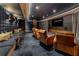 Private theater room with comfortable seating, a large screen, and elegant lighting at 2425 Peachtree Ne Rd # 1211, Atlanta, GA 30305