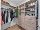 Organized walk-in closet with ample shelving, drawers, and hanging space for clothes and accessories at 2425 Peachtree Ne Rd # 1211, Atlanta, GA 30305