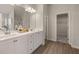 Bright bathroom featuring double vanity, white cabinets, wood-look flooring, and great lighting at 4504 Ajo Lot#2 Walk, Atlanta, GA 30331