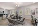 Open-concept living room features a dining area, abundant natural light, and stylish decor for comfortable living at 4504 Ajo Lot#2 Walk, Atlanta, GA 30331