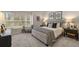 Comfortable main bedroom features plush carpeting, neutral decor, and abundant natural light for a peaceful retreat at 4504 Ajo Lot#2 Walk, Atlanta, GA 30331