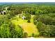 Secluded home surrounded by a dense forest and rolling green fields, offering privacy at 3545 Liberty Rd, Villa Rica, GA 30180