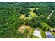 Expansive wooded property with multiple structures, large lawn, and convenient road access at 3545 Liberty Rd, Villa Rica, GA 30180